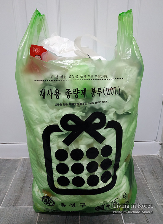 green garbage bag with concept the color of green garbage bags is